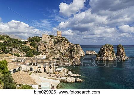 Stock Photograph - Tonnara and the Faraglioni rocks, Scopello, Sicily, Italy. Fotosearch