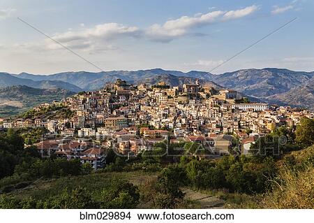 View of hillside town at sunset, Castiglione della Sicilia, Catania, Italy View Large Photo Image Picture - View of hillside town at sunset, Castiglione della Sicilia, Catania, Italy. Fotosearch