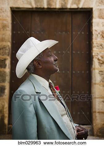Stock Image - Well-dressed Black man looking away. Fotosearch