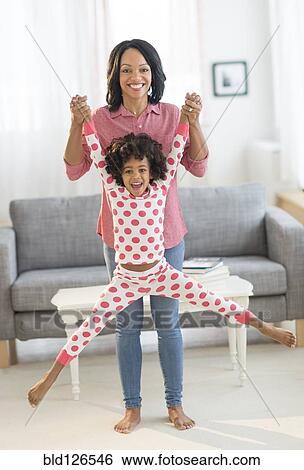 African American mother lifting daughter playfully View Large Photo Image Stock Photograph - African American mother lifting daughter playfully. Fotosearch