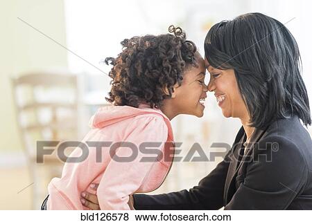 Black mother and daughter rubbing noses View Large Photo Image Stock Photo - Black mother and daughter rubbing noses. Fotosearch