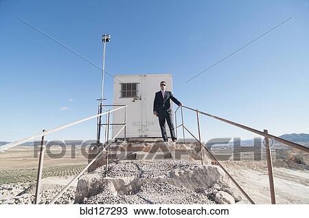 businessman in front of office container View Large Photo Image Stock Image - businessman in front of office container. Fotosearch