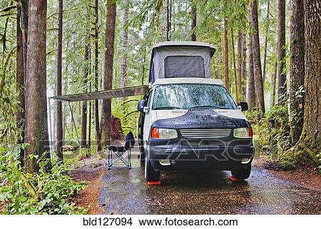 Camper van with awning parked at campsite View Large Photo Image Picture - Camper van with awning parked at campsite. Fotosearch