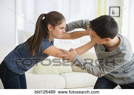Stock Photo - Caucasian brother and sister fighting. Fotosearch