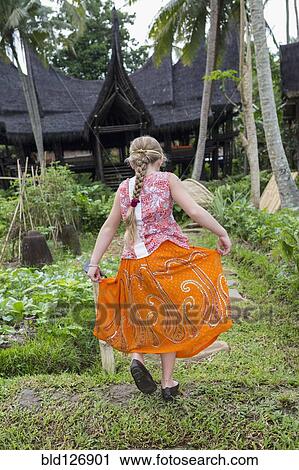 Caucasian girl walking in garden, Ubud, Bali, Indonesia View Large Photo Image Stock Image - Caucasian girl walking in garden, Ubud, Bali, Indonesia. Fotosearch