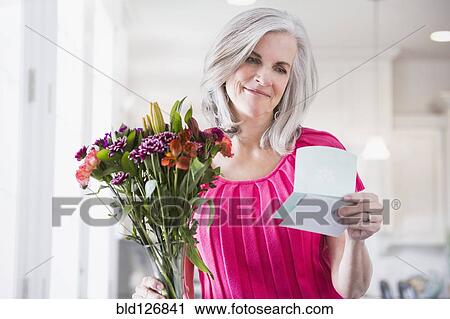 Caucasian woman receiving bouquet of flowers View Large Photo Image Stock Image - Caucasian woman receiving bouquet of flowers. Fotosearch