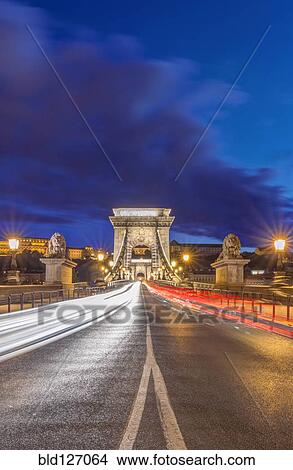 Chain Bridge illuminated at dusk, Budapest, Hungary View Large Photo Image Picture - Chain Bridge illuminated at dusk, Budapest, Hungary. Fotosearch