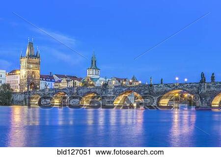 Charles Bridge and city illuminated at dusk, Prague, Czech Republic View Large Photo Image Stock Image - Charles Bridge and city illuminated at dusk, Prague, Czech Republic. Fotosearch