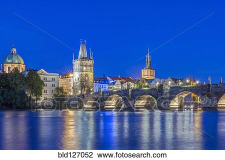 Charles Bridge and city illuminated at dusk, Prague, Czech Republic View Large Photo Image Stock Image - Charles Bridge and city illuminated at dusk, Prague, Czech Republic. Fotosearch