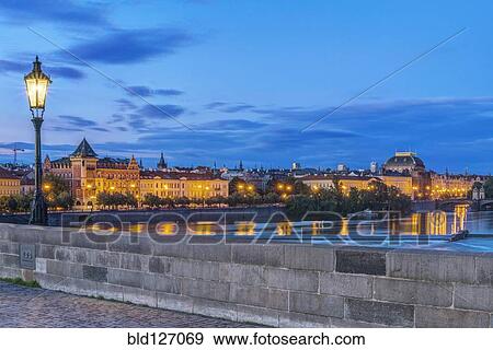 Charles Bridge and city illuminated at dawn, Prague, Czech Republic View Large Photo Image Stock Photo - Charles Bridge and city illuminated at dawn, Prague, Czech Republic. Fotosearch