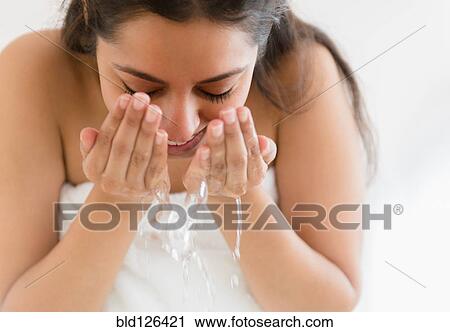 Close up of Asian woman washing face View Large Photo Image Stock Image - Close up of Asian woman washing face. Fotosearch