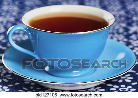Close up of tea in blue china tea cup View Large Photo Image Stock Photograph - Close up of tea in blue china tea cup. Fotosearch