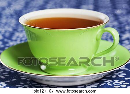 Close up of tea in green china tea cup View Large Photo Image Stock Photo - Close up of tea in green china tea cup. Fotosearch