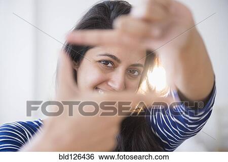 Close up portrait of Asian woman making finger frame View Large Photo Image Stock Photograph - Close up portrait of Asian woman making finger frame. Fotosearch