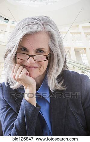 Close up portrait of smiling Caucasian businesswoman View Large Photo Image Stock Photo - Close up portrait of smiling Caucasian businesswoman. Fotosearch