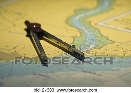 Stock Image - compass and map. Fotosearch