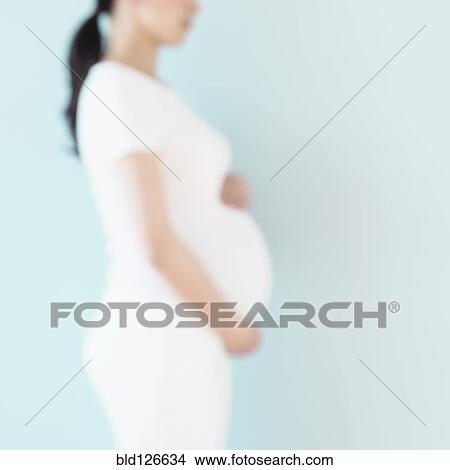 Defocused profile of pregnant Japanese woman View Large Photo Image Picture - Defocused profile of pregnant Japanese woman. Fotosearch
