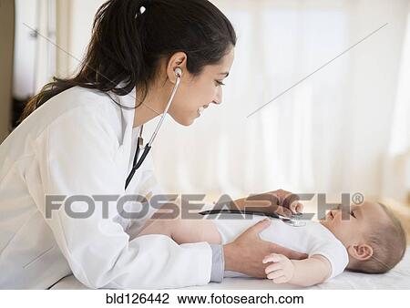 Doctor examining baby View Large Photo Image Stock Image - Doctor examining baby. Fotosearch