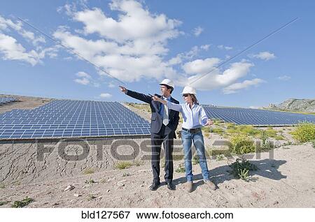 Stock Photo - engineer and businessman in solar plant. Fotosearch