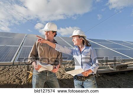 Picture - engineers in solar plant. Fotosearch