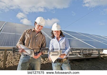 Stock Photography - engineers in solar plant. Fotosearch
