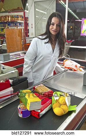female cashier at supermarket checkout View Large Photo Image Stock Image - female cashier at supermarket checkout. Fotosearch