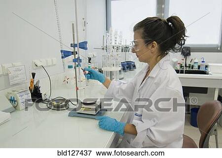 Female lab technician wearing safety glasses checking sample View Large Photo Image Stock Photo - Female lab technician wearing safety glasses checking sample. Fotosearch