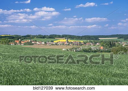 Green wheat fields surrounding town, Prague, Central Bohemia, Czech Republic View Large Photo Image Stock Photo - Green wheat fields surrounding town, Prague, Central Bohemia, Czech Republic. Fotosearch