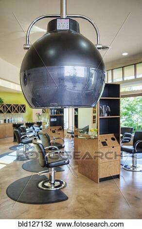 Hair dryer in empty beauty salon View Large Photo Image Stock Image - Hair dryer in empty beauty salon. Fotosearch