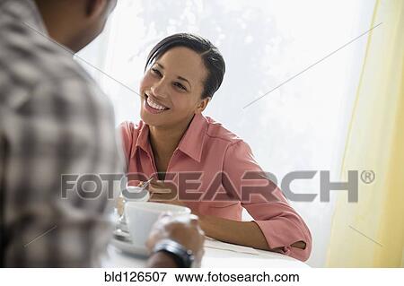 Stock Photo - Happy couple drinking coffee. Fotosearch