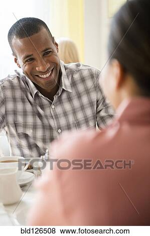 Happy couple drinking coffee View Large Photo Image Stock Photo - Happy couple drinking coffee. Fotosearch
