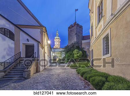 Stock Image - Illuminated alley and tower, Mikulov, Southern Moravia, Czech Republic. Fotosearch