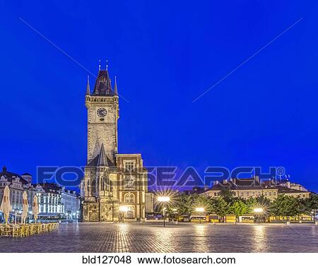 Illuminated piazza and old town hall at dawn, Prague, Czech Republic View Large Photo Image Stock Photo - Illuminated piazza and old town hall at dawn, Prague, Czech Republic. Fotosearch