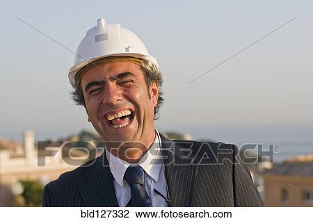 laughing businessman wearing hard hat View Large Photo Image Stock Image - laughing businessman wearing hard hat. Fotosearch
