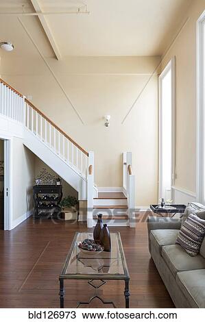 Stock Image - Living room and stairs. Fotosearch