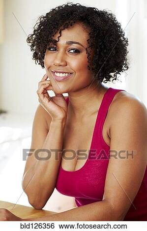 Stock Photograph - Mixed race woman smiling. Fotosearch