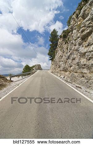 Mountain road running to vanishing point View Large Photo Image Stock Photography - Mountain road running to vanishing point. Fotosearch