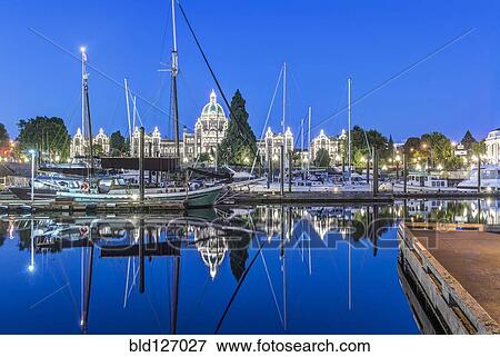 Parliament Buildings and harbor illuminated at dawn, Victoria, British Columbia, Canada View Large Photo Image Stock Photo - Parliament Buildings and harbor illuminated at dawn, Victoria, British Columbia, Canada. Fotosearch
