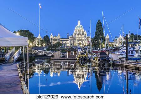 Parliament Buildings and harbor illuminated at dawn, Victoria, British Columbia, Canada View Large Photo Image Stock Photo - Parliament Buildings and harbor illuminated at dawn, Victoria, British Columbia, Canada. Fotosearch