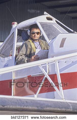 Pilot Sitting in a Cockpit of a Private Plane View Large Photo Image Stock Image - Pilot Sitting in a Cockpit of a Private Plane. Fotosearch
