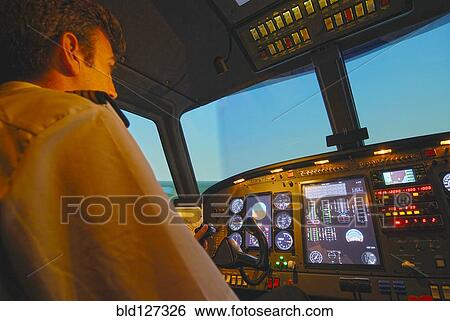 Stock Photograph - Pilots in aircraft cockpit. Fotosearch