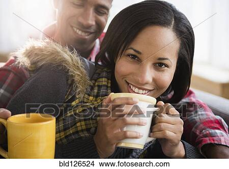 Portrait of happy couple drinking coffee View Large Photo Image Picture - Portrait of happy couple drinking coffee. Fotosearch