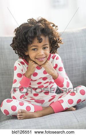 Portrait of smiling African American girl in pajamas View Large Photo Image Stock Image - Portrait of smiling African American girl in pajamas. Fotosearch