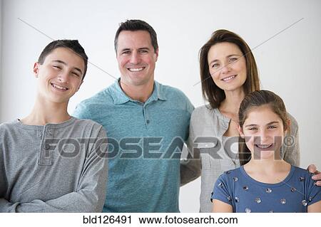 Stock Image - Portrait of smiling Caucasian family. Fotosearch