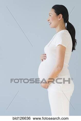 Profile of pregnant Japanese woman View Large Photo Image Stock Photograph - Profile of pregnant Japanese woman. Fotosearch