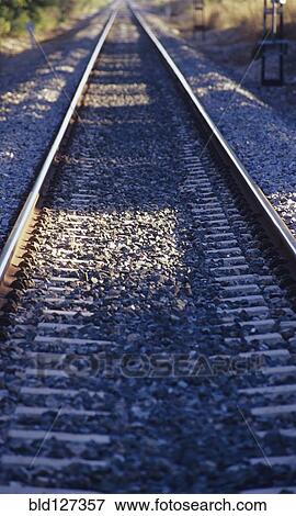 Stock Photo - Railroad Tracks Leading to a Vanishing Point. Fotosearch