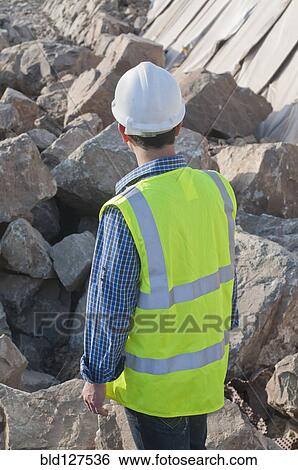 rear view of engineer in construction site View Large Photo Image Stock Photograph - rear view of engineer in construction site. Fotosearch
