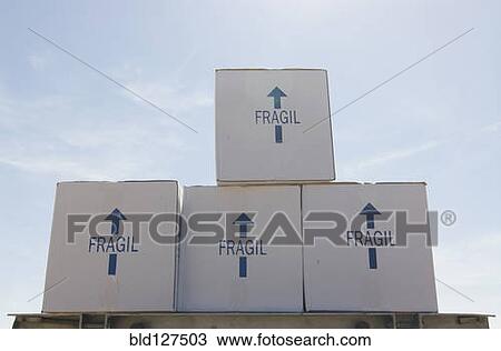 Removal boxes piled on crate low angle View Large Photo Image Stock Image - Removal boxes piled on crate low angle. Fotosearch