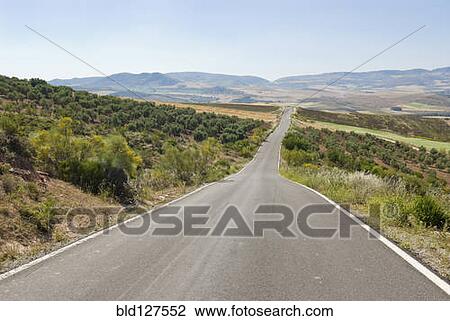 Stock Image - Road running to vanishing point. Fotosearch