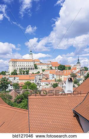 Stock Photograph - Rooftops and castle, Prague, Czech Republic. Fotosearch
